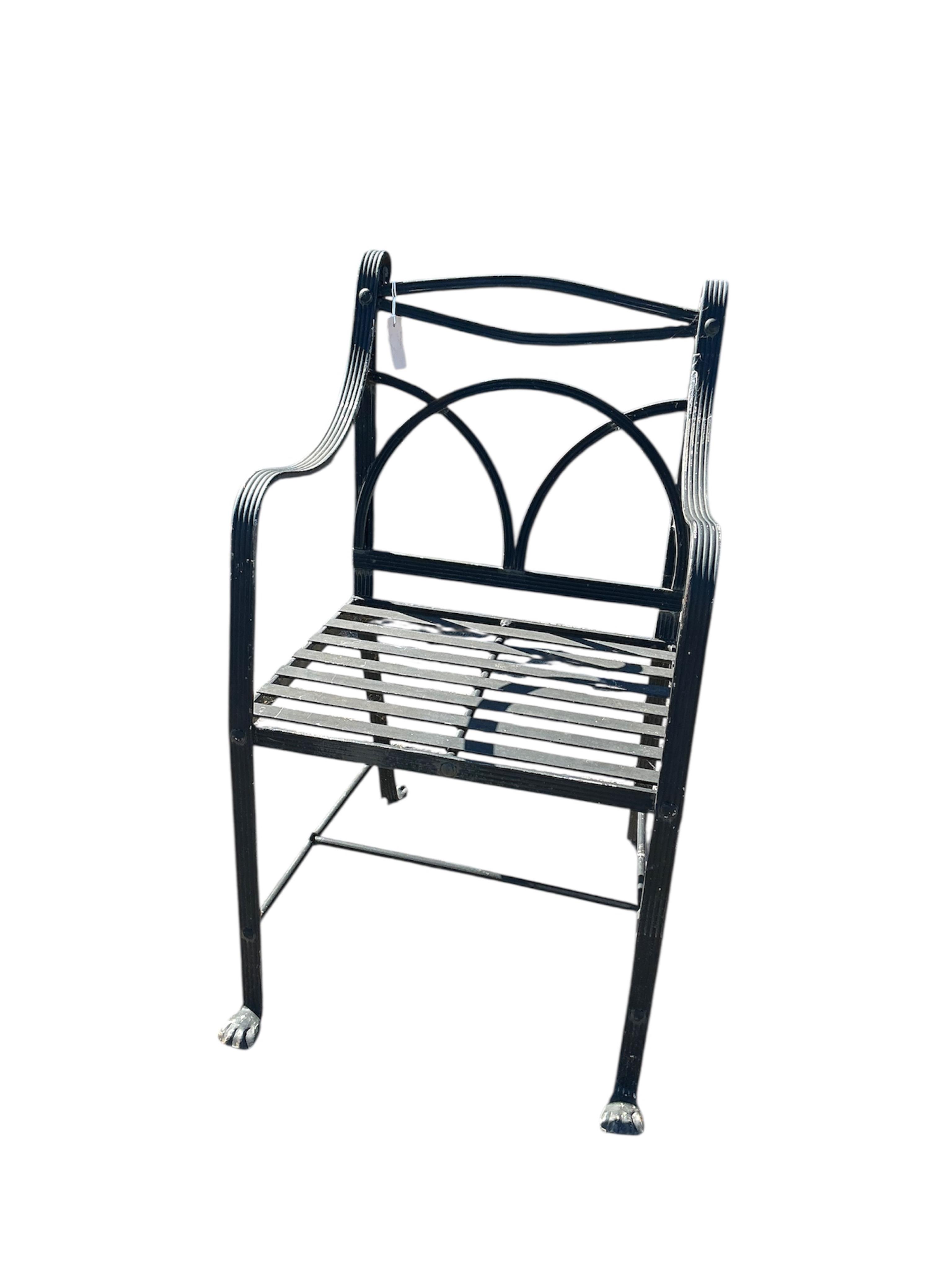 A set of four wrought iron garden chairs, width 53cm, depth 42cm, height 95cm